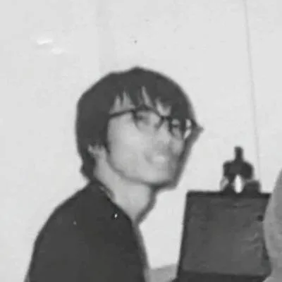 Black-and-white selfie of Koichi Nakayamada wearing glasses
